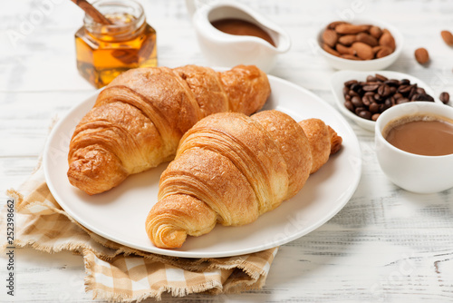 Stampa su Tela Delicious breakfast with fresh croissants.