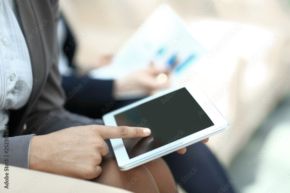 close up.business woman presses the digital tablet screen