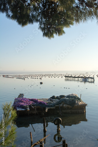 Barge Covered by Fish Nets in the Mar Piccolo in Taranto at Sunrise