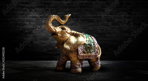 Golden elephant on a wooden...