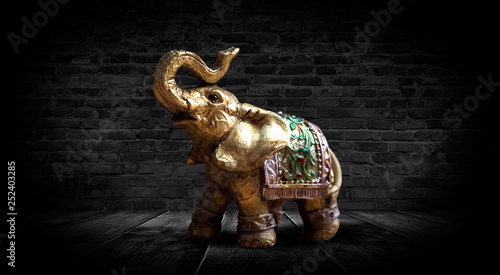 Golden elephant on a wooden...