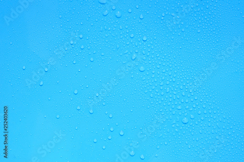 water drop on blue plastic texture