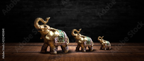 Golden elephant on a wooden...