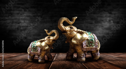 Golden elephant on a wooden...