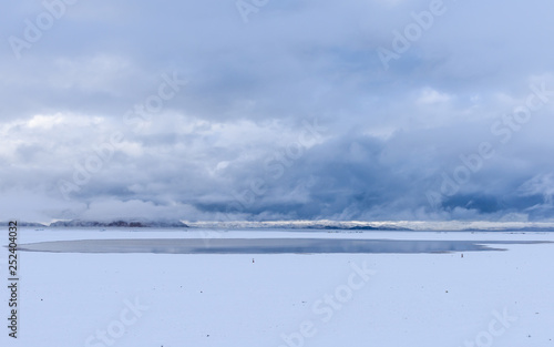 snow scene of the lake Namtso ( or Lake Nam; Nam Co), which is a mountain lake in Damxung(Dangxiaong) County, Lhasa, Tibet, China, lies on the west side of the  Nyenchen Tanglha Mountains. photo