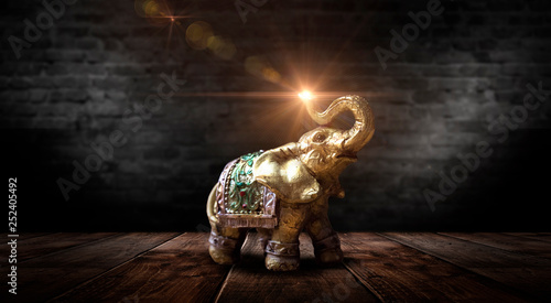 Golden elephant on a wooden...
