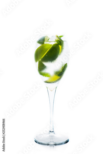 Royal mojito cocktail lime and mint isolated on white background. Selective focus. Shallow depth of field.