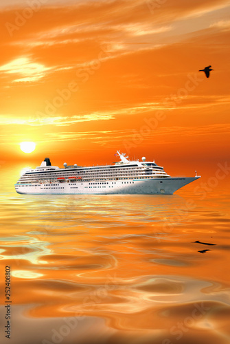 Sunset at Mediterranean sea and big passenger ship.