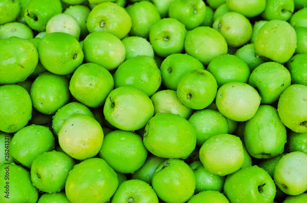 Fresh Thai milk jujube, Putsa Fruit (Ziziphus zizyphus) texture pattern background. Thai milk jujube is delicious tropical edible fruit has green smooth skin ,white pulp similar to apple Fresh Thai milk jujube, Putsa Fruit (Ziziphus zizyphus) texture pattern background. Thai milk jujube is delicious tropical edible fruit has green smooth skin ,white pulp similar to apple