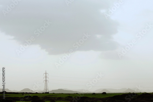 Power tower in cloudy weather, Maharashtra, India.