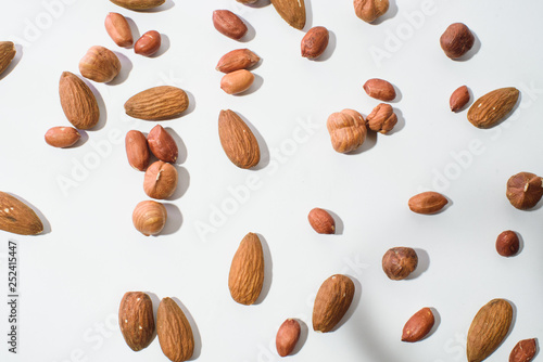 Pattern of nuts mix with copy space. Various nuts isolated on white.