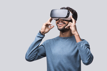 Young man using virtual reality headset. VR, future, gadgets, technology concept