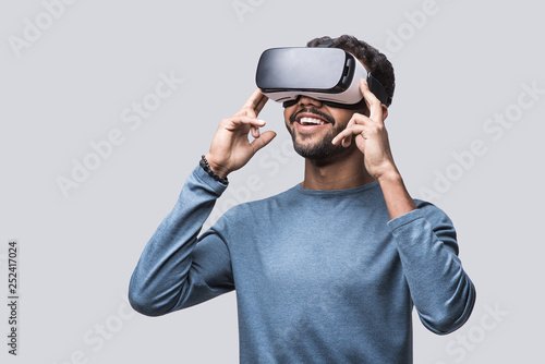 Young man using virtual reality headset. VR, future, gadgets, technology concept photo