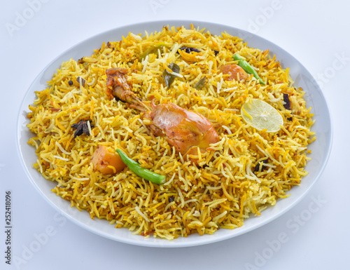 Chicken Biryani, a yummy & fluffy rice dish with spicy savory chicken pieces with salad. photo