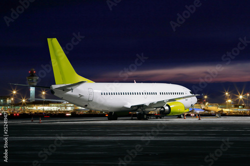 Preparation of the airplane before flight at night photo