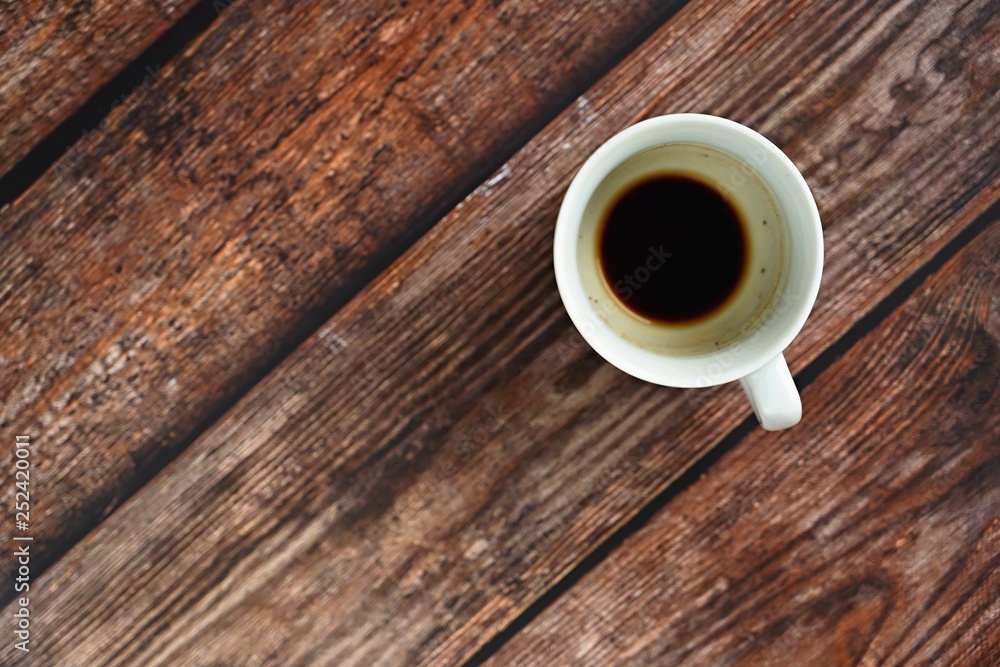 Blank and dirty white coffee mug on a wooden background Blank and dirty white coffee mug on a wooden background