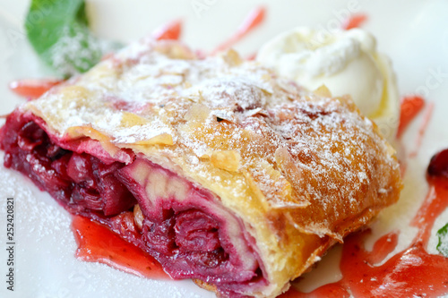 Cherry strudel with ice cream and mint