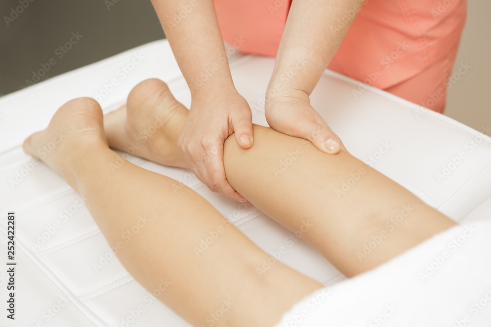 Beautiful female client enjoying full body massage at the spa salon Beautiful female client enjoying full body massage at the spa salon