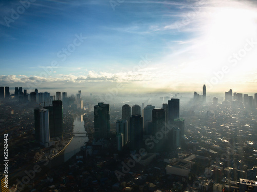 Sunset over a skyscraper city top view cityscake skyscraper