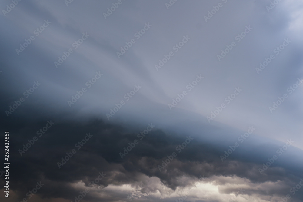 Naklejka premium Scary epic sky with menacing clouds. Hurricane wind with a thunderstorm. Stock background, photo