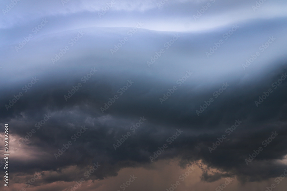Obraz premium Scary epic sky with menacing clouds. Hurricane wind with a thunderstorm. Stock background, photo
