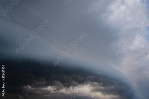 Scary epic sky with menacing clouds. Hurricane wind with a thunderstorm. Stock background, photo photo