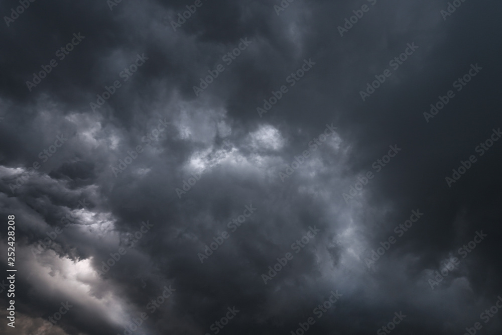 Scary epic sky with menacing clouds. Hurricane wind with a thunderstorm. Stock background, photo Scary epic sky with menacing clouds. Hurricane wind with a thunderstorm. Stock background, photo