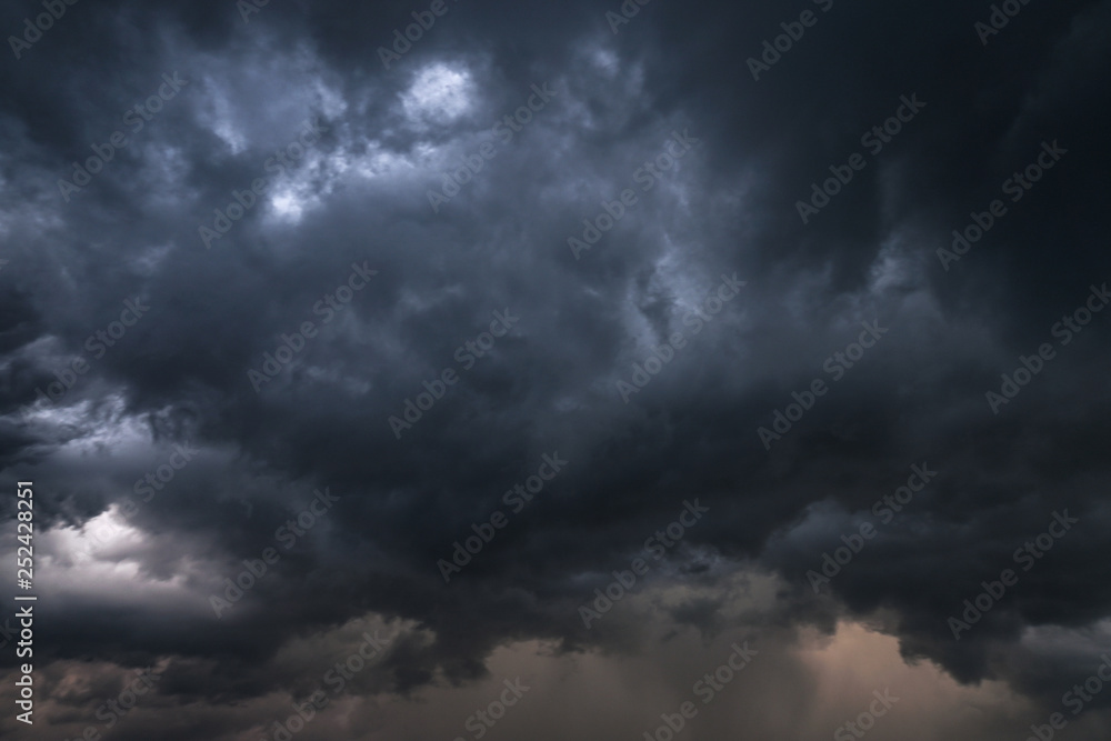 Scary epic sky with menacing clouds. Hurricane wind with a thunderstorm. Stock background, photo Scary epic sky with menacing clouds. Hurricane wind with a thunderstorm. Stock background, photo
