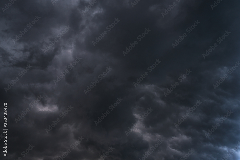 Scary epic sky with menacing clouds. Hurricane wind with a thunderstorm. Stock background, photo