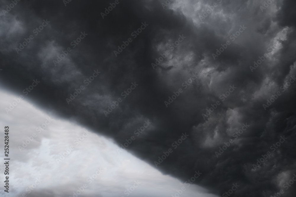 Scary epic sky with menacing clouds. Hurricane wind with a thunderstorm. Stock background, photo Scary epic sky with menacing clouds. Hurricane wind with a thunderstorm. Stock background, photo