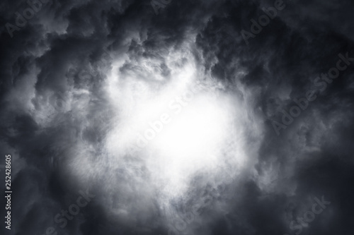 Scary epic sky with menacing clouds. Hurricane wind with a thunderstorm. Stock background, photo