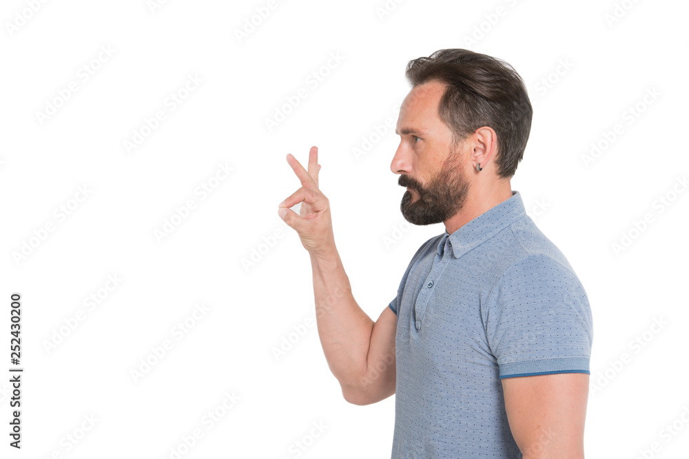 Profile portrait of calm bearded man showing ok sign Profile portrait of calm bearded man showing ok sign