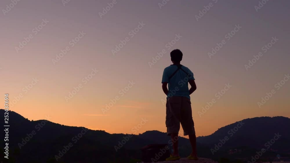 Professional man controls drone with Beautiful sky sunset or sunrise time