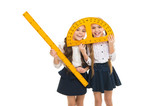 Having fun in school. Pupil cute girls with big rulers. School children with measuring instruments. Geometry favorite subject. Education and school concept. School students learning geometry