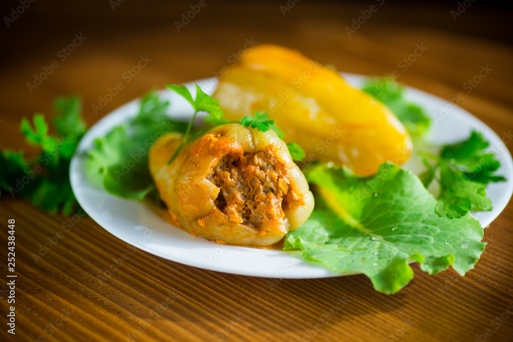 stewed in tomato sauce stuffed peppers in a plate stewed in tomato sauce stuffed peppers in a plate
