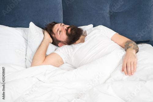 Man bearded hipster having problems with sleep. Guy lying in bed try to relax and fall asleep. Relaxation techniques. Violations of sleep and wakefulness. Sleepless night. Sleep disorders concept © be free