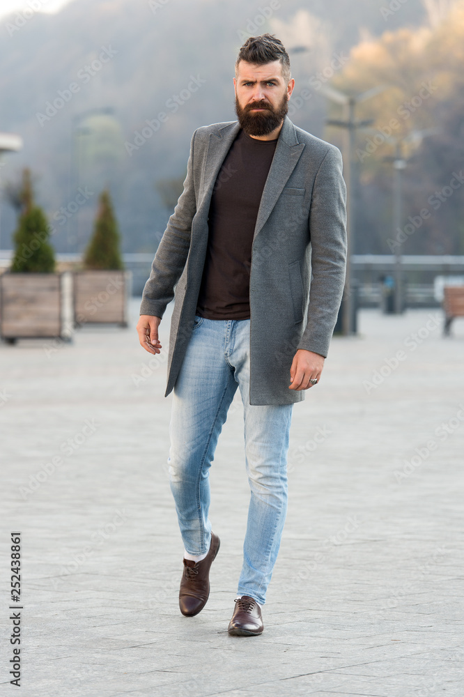 Stylish casual outfit spring season. Menswear and male fashion concept. Man  bearded hipster stylish fashionable coat or jacket. Comfortable outfit. Hipster  fashion model outdoors. Urban fashion Stock Photo