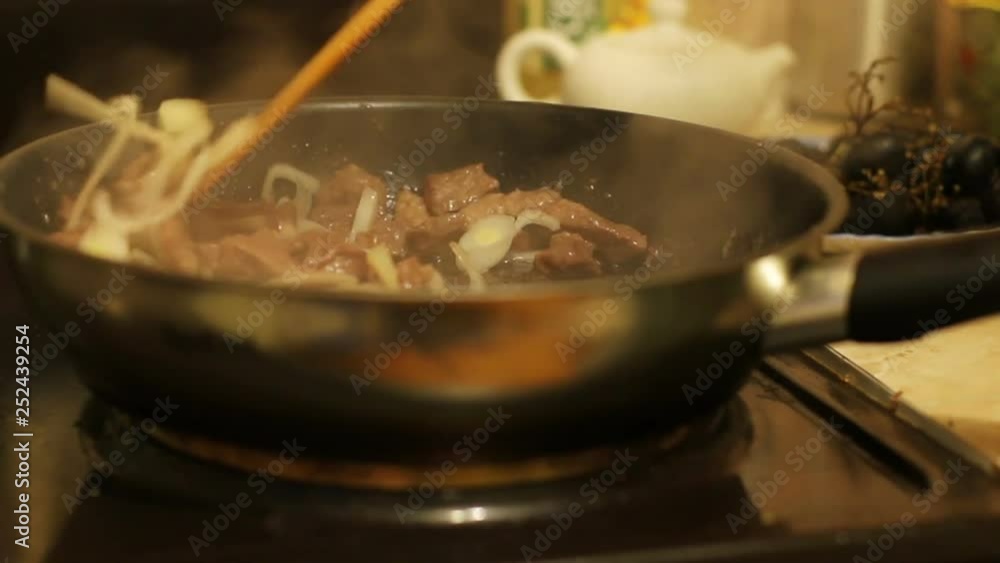 Raw meat beef fry in a pan close-up Raw meat beef fry in a pan close-up