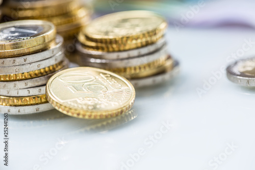 Towers with euro coins stacked together - close-up