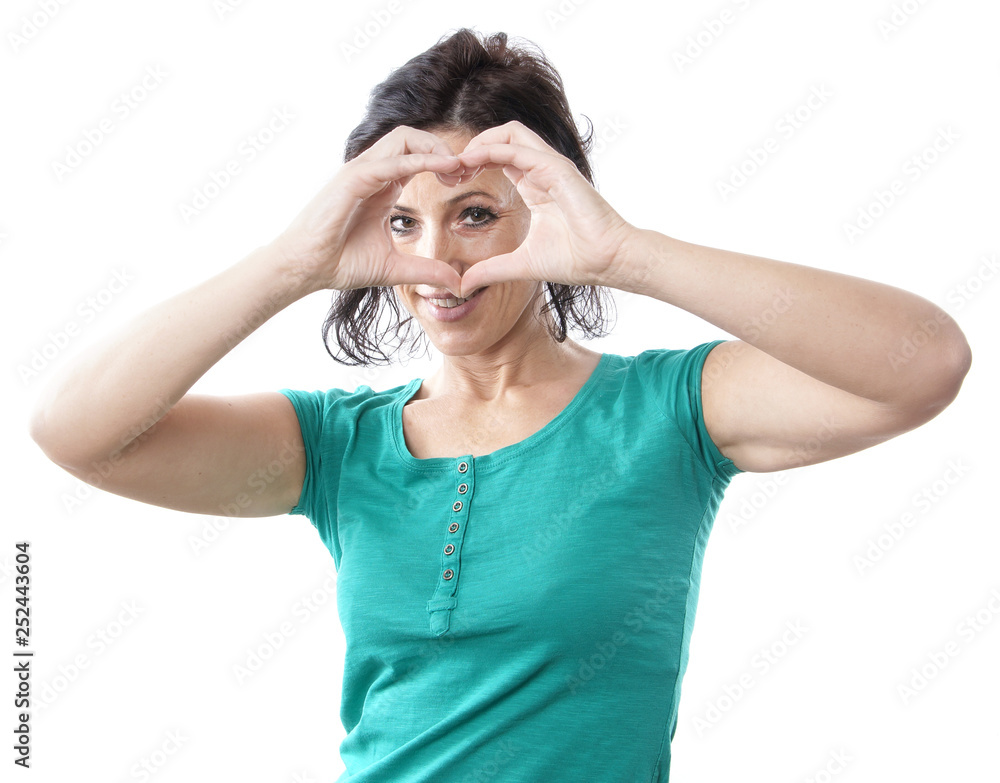 mature woman forming heart shape with her hands mature woman forming heart shape with her hands