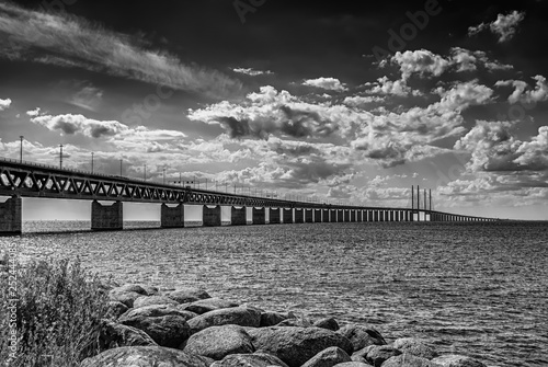 Oresundsbron From Rocky Beach in Black and White photo