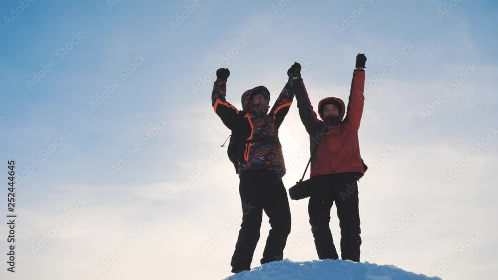 teamwork. group men winter snow mountains team tourists joy success achievement raised their hands up rejoice goals winners rejoice raised their hands up jump lifestyle. people teamwork business teamwork. group men winter snow mountains team tourists joy success achievement raised their hands up rejoice goals winners rejoice raised their hands up jump lifestyle. people teamwork business