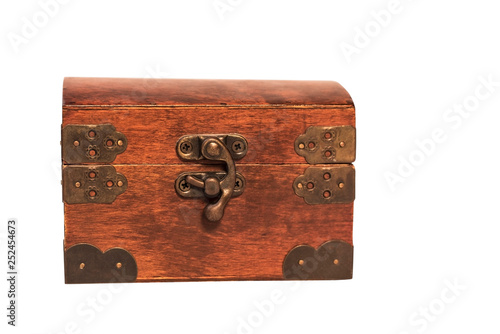 Closed wooden vintage box for storing jewelry on a white background