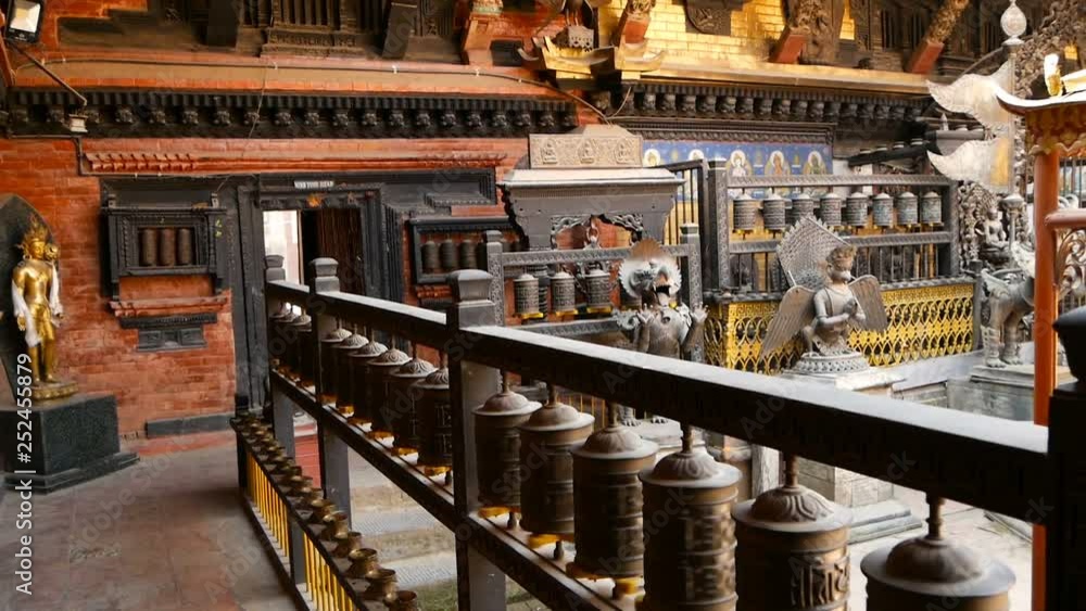 Ancient bronze and brass decorated temple, Rudra Varna Mahavihar, unique buddhist shrine with plenty of prayer wheels in Lalitpur (Patan). World heritage site. Tibetan buddhism. Durbar Square, Nepal. Ancient bronze and brass decorated temple, Rudra Varna Mahavihar, unique buddhist shrine with plenty of prayer wheels in Lalitpur (Patan). World heritage site. Tibetan buddhism. Durbar Square, Nepal.