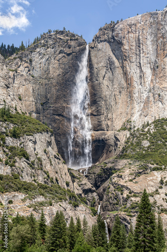 High Sierra Waterfall - Yosemite Falls  one of America   s tallest waterfalls  plunges into the beautiful Yosemite Valley in California   s Sierra Nevada Mountain Range.