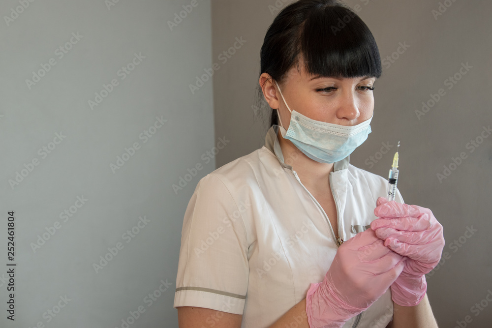 Doctor cosmetologist makes Rejuvenating facial injections procedure for tightening and smoothing wrinkles on face skin of beautiful, young woman in beauty salon.Cosmetology skin care.