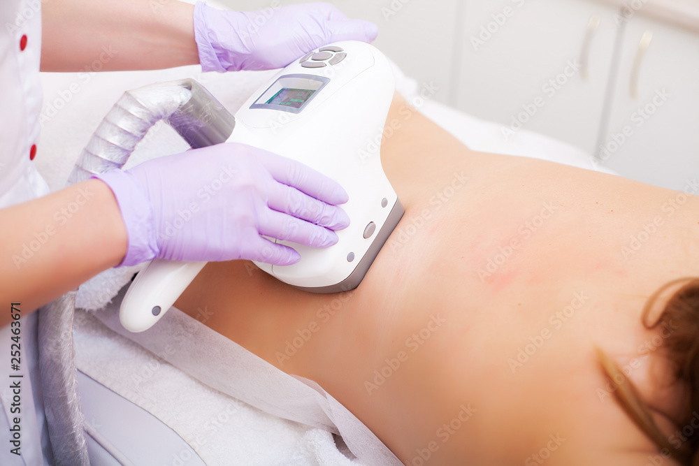 Naklejka premium Body Care. Woman is in the process at the clinic lipomassage