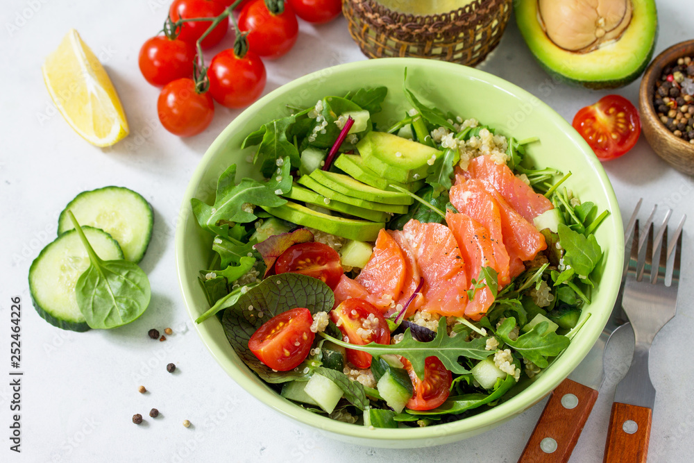 Diet menu concept. Summer Healthy salad with quinoa, Tomatoes, Salmon, Avocado and arugula. Diet menu concept. Summer Healthy salad with quinoa, Tomatoes, Salmon, Avocado and arugula.