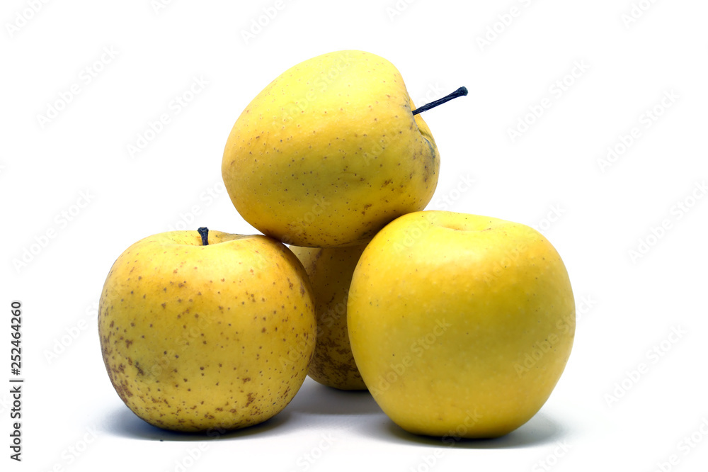Several yellow apples folded by a slide