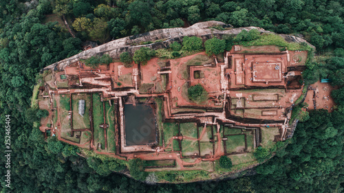 Close shot by drone in Sigiriya, Sri Lanka. Aerial view of lion rock in the tropical forest